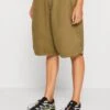 BDG Urban Outfitters Baggy Longline- Shorts - Khaki -Tienda barata Ulla Popken 132a2f9f89624b2f8e33ad773d25786f